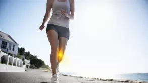 Closeup Of Female Running On Road