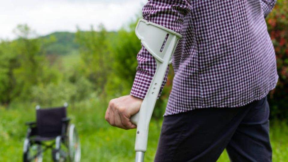 Close Up Of Man Walking With Crutches