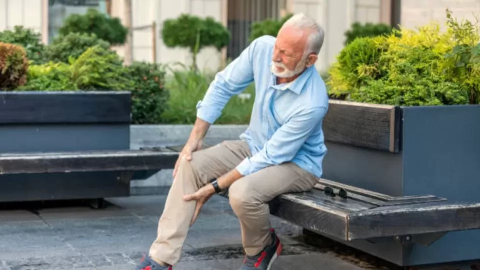 Senior Man Holding His Knee Due To Pain